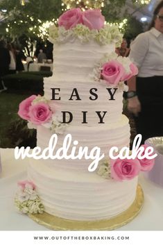 a white wedding cake with pink flowers on it and the words easy diy wedding cake