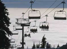 a ski lift with people on it and the caption says, whenever i go snowboarding and the ski lift stops i always judge whether or not would live from the fall if