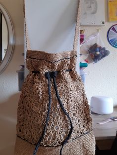 Women's bag crocheted from paper raffia in color craft. Raffia is a natural, environmentally friendly, biodegradable and hygroscopic material. The bag is stylish, comfortable, roomy, light and very durable, it will last more than one year. For the season spring-summer-autumn.  The black drawstring on the bag can be tightened. Dimensions: wide 35 cm height 40 cm base width 8 cm strap length 90 cm Care: Do not wash. Wipe it with a clean damp cloth. In case the bag is wrinkled or out of shape, you can steam it with an iron at medium temperature. Can be sent to you immediately after ordering. If you have any questions regarding this bag, feel free to ask. You can also find me on Instagram @liana.knitting.craft Eco-friendly Jute Crochet Bucket Bag, Natural Jute Crochet Shoulder Bag, Natural Crochet Jute Shoulder Bag, Eco-friendly Natural Color Crochet Beach Bag, Eco-friendly Crochet Straw Bag In Natural Color, Eco-friendly Natural Crochet Straw Bag, Eco-friendly Crochet Shoulder Bag In Natural Fiber, Natural Crochet Bucket Bag For Beach, Eco-friendly Crochet Bags In Natural Fiber