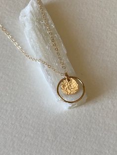 |DESCRIPTION|Delicate Circle Necklace, Gold Hammered Disc, Halo Necklace, Minimalist Jewelry, Bridesmaid Gift Idea, Everyday Necklace, Birthday GiftSweet and dainty small circle with hammered disc, perfect for everyday wear or a great gift idea.. Made of 14k gold fill. Circle measures 16mm and hand hammered disc measures 10mm. Your choice of length of chain|CURRENT PRODUCTION SCHEDULE|All items are made to order so please check the top of our policies page for the up to date production and deliv Dainty Hammered Circle Jewelry, Dainty Charm Necklace With Hammered Detail For Gift, Dainty Hammered Round Jewelry, Dainty Hammered Charm Necklaces For Everyday, Dainty Hammered Round Pendant Jewelry, Tiny Round Minimalist Charm Necklace, Minimalist Tiny Round Charm Necklace, Tiny Minimalist Charm Necklace, Minimalist Hammered Necklace For Anniversary