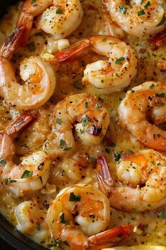 a skillet filled with shrimp and sauce