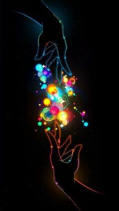 two hands reaching out towards each other with glowing balls in the dark sky behind them