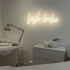 a room with a bed, desk and lamp on it that says wash booe