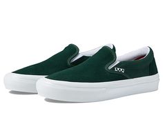 Vans Skate Slip-On - Men's Shoes : Wrapped Green/White : Step-up your skateboarding game with the Vans Skate Slip-On. This classic slip-on boasts branding tabs throughout, a higher side wall and now built extra tough to keep you going for longer skate sessions. Slip-on design with round toe. Reinforced DURACAP suede and canvas uppers. Newly designed two-part foxing tape that offers a deeper knurl pattern on the toe. Padded collar. Elastic side accents. POPCUSH energy return sockliner and removab Urban Slip-on Skate Shoes For Sports, Urban Style Slip-on Skate Shoes For Sports, Vans Slip-on Skate Shoes For Streetwear, Sporty Slip-on Sneakers For Skateboarding, Vans Slip-ons With Vulcanized Sole For Streetwear, Vans Vulcanized Sole Slip-ons For Streetwear, Vans Slip-on Sneakers For Skateboarding, Vans Slip-ons For Streetwear, Sporty Vans Slip-ons