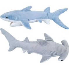 two stuffed shark toys sitting next to each other