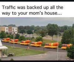 there are many orange objects on the road and in the distance is a sign that says traffic was backed up all the way to your mom's house