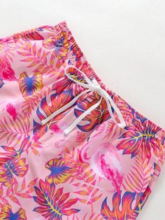 Escape to paradise with these Tropical Print Swim Trunks. The vibrant all-over print and drawstring waist make them a stylish choice for your beach adventures. Stay comfortable with the convenient pocket and non-stretch polyester fabric. Dive into summer in style! Specification: Pattern Type: Tropical, All Over Print Details: Drawstring, Pocket Type: Bottoms Bottom Type: Shorts Fabric: Non-Stretch Material: Polyester Composition: 100% Polyester Care Instructions: Machine wash, do not dry clean, Paisley Shorts, Banana Print, Beach Adventure, Printed Swim, Printed Drawstring, Blue Waves, Beach Shorts, Ditsy Floral, Tropical Print