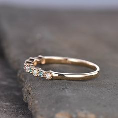 This is a Lab created Alexandrite and Lab created opal Wedding Band in 925 sterling silver. Stones: 1.5mm round cut Lab treated alexandrite ,about 0.33ct + 1.5mm Lab created Opal. Band Width: approx 1.8mm. This ring is marked 925 I accept custom making order.Please contact me if you need this service. This ring is closed ring.If you want a matching band,you can ask me custom make it. For all the jewelries,there is a 14 days money back guarantee.You can return it in the time frame without any que Anniversary Multi-stone Opal Ring, Heirloom Multi-stone Pearl Ring For Wedding, Heirloom Multi-stone Pearl Wedding Ring, Multi-stone Stackable Wedding Rings, Multi-stone Stackable Round Band Wedding Rings, Wedding Stackable Rings With Multi-stone Design, Opal Multi-stone Anniversary Rings, Multi-stone Stackable Round Band Rings For Wedding, Opal Multi-stone Rings For Anniversary