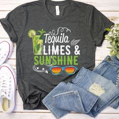 "Embrace the vibrant spirit of summer with our \"Tequila, Limes, and Sunshine\" T-shirt! This design captures the essence of warm, sunny days filled with refreshing drinks and relaxation. Featuring a stylish graphic of a cocktail and sunglasses, this tee is the perfect way to express your love for the ultimate summer trifecta. Carefully crafted with comfort in mind, this t-shirt is made from premium-quality, soft cotton fabric that feels great against your skin. The unisex fit ensures a flatteri Margarita Shirt, Sunshine Shirt, Tequila Shirt, Shirt Tag, Day Drinking, Drinking Shirts, Limassol, Vacation Shirts, Refreshing Drinks