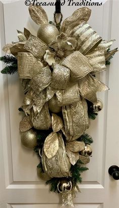 a christmas wreath hanging on the front door