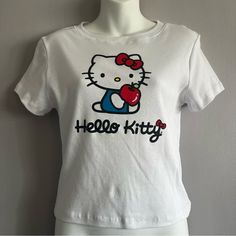 Never Worn, Size Medium Cute White Stretch T-shirt, Playful White Stretch Top, Fitted Cotton Hello Kitty Top, Casual Hello Kitty Print Stretch Tops, Casual Stretch Tops With Hello Kitty Print, Fitted Hello Kitty Print T-shirt For Summer, Cute White Stretch Tops, White Hello Kitty Casual Tops, Casual Hello Kitty T-shirt For Spring