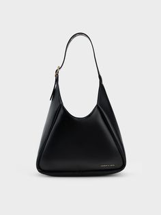 Practical and effortlessly chic, the Buzz hobo bag in versatile black is the perfect everyday style companion. Equal parts structured and slouchy, this capacious carryall features a magnetic closure that opens up into a roomy interior that offers plenty of space for all your must-have items. Bonus points for the adjustable strap, which allows you to find your desired drop length with ease. Everyday Black Bag, Hobo Bag Outfit, Oldies Fashion, Charles And Keith Bags, Fashion Kimono, Bag Photography, Slouchy Tote, Large Hobo Bag, Slouchy Bag