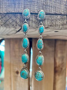 Cinco Turquoise Drop Earrings are sure to add a touch of sophistication to any ensemble. Handcrafted with genuine turquoise stones and sterling silver, these stud earrings feature a dangle design to shimmer with grace. Exuding a luxurious look and feel, they'll be sure to turn heads. Western Turquoise Dangle Earrings, Southwestern Turquoise Drop Earrings, Western Style Turquoise Nickel-free Earrings, Turquoise Nickel-free Southwestern Teardrop Earrings, Turquoise Nickel-free Southwestern Earrings, Turquoise Drop Earrings, Genuine Turquoise, Turquoise Stone, Stud Earrings