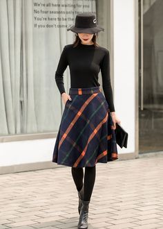 "This winter wool skirt is a classic piece of tailoring that will see you through rain or shine. It is cut with a flattering flared skirt to give you a wonderful shape. The winter skirt is perfect classic styling. This is a versatile skirt that you'll wear again and again. DETAILS: * 30% wool, 30% fiber, 40% polyester * fully satiny liner * Two side pockets * Right zip closure * A letter Back elastic, comfortable wear * Plus size full skirt * Perfect for Winter, autumn * Learn More about the ite Relaxed Knee-length Mini Skirt For Fall, Fall Workwear Full Mini Skirt, Relaxed Lined Skirt For Winter, Full Mini Skirt For Workwear In Fall, Winter Relaxed Lined Skirt, Winter Lined Midi Pencil Skirt, Fall Pleated Midi Skirt, Relaxed Knee-length Pencil Skirt For Winter, Wool Flared Skirt For Fall