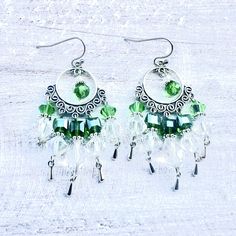 All metals are nickel and lead free. Green Dangle Crystal Earrings, Adjustable Silver Chandelier Earrings With Dangling Beads, Green Nickel Free Dangle Chandelier Earrings, Green Nickel-free Dangle Chandelier Earrings, Green Teardrop Nickel-free Chandelier Earrings, Green Teardrop Chandelier Earrings Nickel Free, Green Metal Dangle Teardrop Earrings, Adjustable Metal Dangle Chandelier Earrings, Circle Chandelier