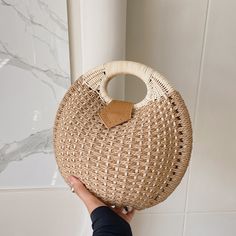 Straw rattan bags are the perfect fashion accessory to wear everywhere, anytime. This Woven Rattan Round Shaped Handbag is carefully designed and handmade by artisans from all over the world. Eco-friendly Palm Leaf Bag With Open Weave, Straw Bag With Bamboo Top Handle, Summer Straw Bag With Woven Leather And Round Handle, Summer Woven Leather Bag With Round Handle, Straw Top Handle Bag With Bamboo Detail, Top Handle Straw Bag With Bamboo Handle, Eco-friendly Crochet Bag With Woven Leather, Beige Straw Bag With Round Handle For Vacation, Beige Crochet Straw Bag With Round Handle