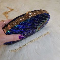 Beautiful, it's time to shine! Stop looking for where to find the perfect sequin clutch. If you're in search of the most magnificent clutch bag you've ever owned, we found it for you! Ladies and gentlemen, we give you the Teal Sequin Peacock Clutch Bag. The beauty par excellence, this stunning peacock bag is the epitome of luxury, elegance, style, and whimsy, making it the most sought-after sequin clutch to shine at every evening party! A sophisticated statement accessory with an authentic Boho Sequin Clutch Evening Bag For Gifts, Sequin Clutch Evening Bag As Gift, Sequined Pouch Clutch For Parties, Sequin Pouch Clutch For Party, Luxury Sequined Clutch Evening Bag, Evening Sequined Pouch Clutch, Sequined Evening Clutch Pouch, Sequin Pouch Clutch For Evening, Sequin Clutch Evening Bag For Events