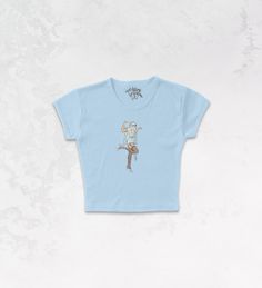 Fun Fitted Tops With Character Print, Cute Fitted Top With Character Print, Fitted Playful Tops With Character Print, Fitted Graphic Tee With Character Print, Playful Fitted Tops With Character Print, Fitted Playful T-shirt With Cartoon Print, Playful Fitted T-shirt With Character Print, Fitted Graphic Tee With Cartoon Print, Fitted Blue T-shirt With Character Print