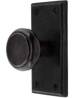 a black door handle with a round knob