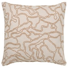 a beige and brown decorative pillow on a white background