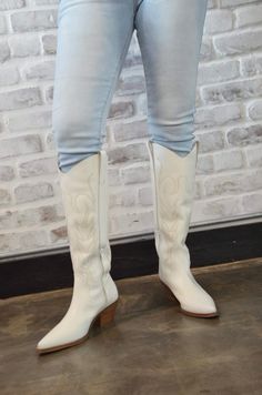 Introducing the “Tall White Boots” – a bold and stylish take on classic cowgirl boots. These striking white boots feature a tall silhouette that adds a touch of modern flair to traditional Western design. Crafted for both comfort and durability, they offer a chic and versatile option for a variety of outfits. Whether you’re dressing up or keeping it casual, the “Tall White Boots” make a statement with their unique color and timeless style. Elevate your footwear collection with these eye-catching cowgirl boots. Trendy White Heeled Boots For Fall, White Boots With Reinforced Heel For Spring, White Heeled Boots For Fall, White Medium Width Heeled Boots For Fall, Trendy White Wide Calf Heeled Boots, White Mid-calf Boots For Spring Outdoor Activities, Chic White Heeled Boots For Fall, Fall Season White Heeled Boots With Reinforced Heel, White Boots With Stacked Heel For Fall