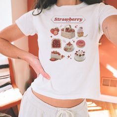 Strawberries are the superior fruit 🍓 ♡ More of Coquette Aesthetic: https://www.etsy.com/shop/RainieshopDesign?ref=seller-platform-mcnav&section_id=1   PRODUCT DETAILS   ♡ Gildan Heavy Cotton™ Tee ♡ Made with 100% cotton ♡ Midweight fabric (5.3 oz/yd² (180 g/m ♡ Loose fit ♡ Sewn-in label ♡ Runs true to size  SIZING   ▸ Models are regular size small and wearing size XS for White and Pink; size S for Ash and Black. ▸ Please refer to the last picture with size chart for sizes and product dimensions.  ▸ Be aware that these shirts are baby tees that can have a snug fit if you choose your normal size your smaller. If you prefer a more relaxed style or find a tight fit uncomfortable, you may want to consider selecting a size 1-2 sizes larger than your usual size. ▸ To find your best fit, take yo Sweet White Tops With Strawberry Print, Sweet Short Sleeve Tops With Fruit Print, Sweet Cotton T-shirt For Gifts, Sweet Cotton T-shirt As Gift, Sweet Cotton Tops With Fruit Print, Cute White Tops With Fruit Design, Cute White Fruit Design Tops, Cute Strawberry Print T-shirt As Gift, Sweet Summer T-shirt As Gift