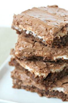 three chocolate brownies stacked on top of each other