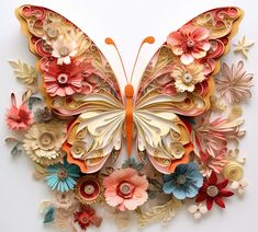 a butterfly made out of paper with flowers on it's wings and petals in the middle