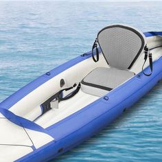 an inflatable boat floating on top of the water with seats attached to it