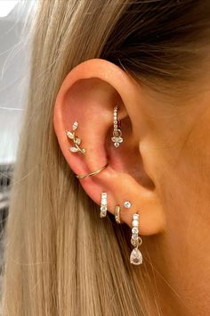 Discover the UK's finest selection of dainty solid gold cartilage huggieshoopsstuds for helixhigh loberooktragusdaith and conch at Laura BondWe ship worldwide Multiple Piercings Earrings, Ear Style