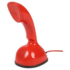 an old fashioned red telephone on a white background