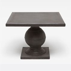 a small table with a black base on a white background