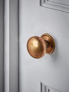 a door handle on a white door