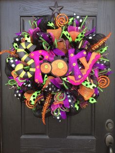 a halloween wreath with the word joy on it