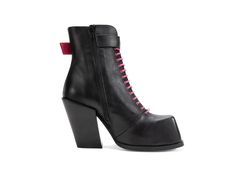 a pair of black boots with pink laces on the side and heeled heels