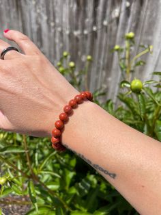 "Engage with the world around you better with this Red Jasper crystal Bracelet!  Boost your confidence with this Red Jasper Bracelet. Red Jasper gives a sense of wellbeing, intensifying that feeling. By bringing inner stability and strength, Red Jasper allows you to provide peaceful energy in your relationships. It is believed that Jasper has the ability to create and help balance aggressive, dynamic energy.  Other healing properties: ~ Power ~ Nurturing Energy ~ Mastering your Fears ~ Reduces Inflammation ~ Improves Focus ~ Living in the Present  ~ Manifestation ~ Leadership Chakra: Sacral & Root Zodiac: Libra & Scorpio Each gemstone bracelet is handmade with polished, 8mm round beads & stretchy string. The bracelet's length is 7.5\" inches, stretchy enough to fit most peoples' wrists. Th Red Hypoallergenic Spiritual Bracelet, Spiritual Red Beaded Bracelets For Everyday, Red Spiritual Beaded Bracelets For Everyday, Red Jasper Crystal, Red Jasper Bracelet, Peaceful Energy, Jasper Bead Bracelet, Libra Scorpio, Jasper Bracelet