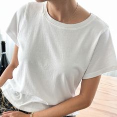 Meet the Darling Tee — It features a relaxed boxy silhouette that hits the waist perfectly, it offers gently distressed details and a 90's fade for true vintage connoisseurs. Crafted from locally sourced cotton, this tee combines a light, airy feel with a structured yet soft touch, making it comparable to a loved vintage tee. Used with the softest local 100% cotton* low gauge knit. Garment washed and dyed each tee for a beautiful natural worn-in look. Made in Los Angeles, USA Content: 100% Cotto Summer Boxy Fit Washed Tops, Washed Cotton Cropped Short Sleeve T-shirt, Washed Cotton Cropped T-shirt With Short Sleeves, Washed Cotton Cropped T-shirt Relaxed Fit, Cropped Washed Cotton T-shirt With Relaxed Fit, Washed Cotton Relaxed Fit Cropped T-shirt, Relaxed Fit Washed Cotton Cropped T-shirt, Casual Washed Cropped T-shirt, Washed Short Sleeve Cropped T-shirt