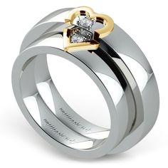 a yellow gold wedding ring set with two diamonds