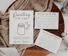 some paper with writing on it next to a jar and two other items that are sitting on top of a table