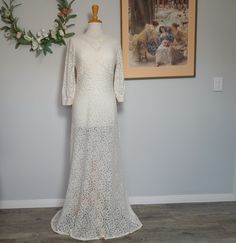 Elegant 1930s Evening Gown with Train. An amazing 1930's wedding dress, lovely and long, with a small train, and made from beautiful antique Art Silk lace.   The antique rayon embroidery gives the dress a gentle glow to the floral pattern of the lace, very understated and gorgeous as it picks up the fine threads in the light.   The bodice unusually features hand crocheted 1900's Irish Lace, and the sleeves can be worn either 3/4 length, or you can push up the sleeve to create a puffed sleeve.  T 1930s Wedding Dress, 1930s Wedding, Wedding Dress Evening, Irish Lace, Silk Lace, Lace Wedding Dress, Dress Evening, Antique Art, Evening Gown