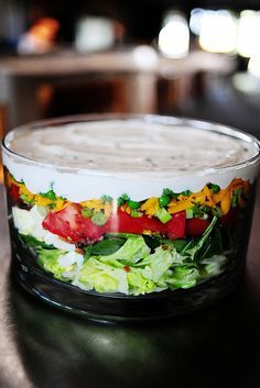 a salad in a glass bowl on a table