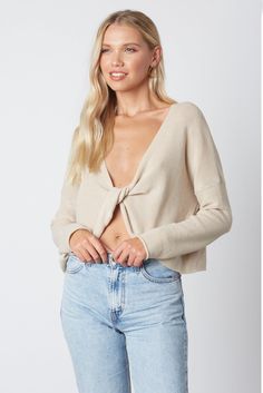 Warm-up in cold weather with the Figure It Out Beige Stone Twist Front Sweater Top! Soft, light beige stone knit sweeps from the plunging twist front neckline into a boxy bodice. Framed by dropped shoulders and long sleeves. Pair this cute top with your favorite jeans for a perfect, on trend look. Beige Stone, Twist Front Top, Boho Pink, Boho Boutique, Cute Cardigans, Pink Boho, Beige Sweater, Cute Sweaters, Cute Top