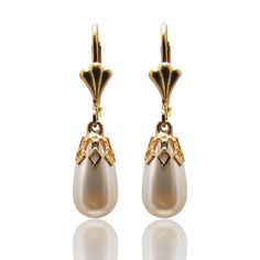 "TearDrop Pearl earrings, vintage inspired for brides or bridesmaids.  Delicate white pearl drop capped with a gold vintage style element. This design has been made with CRYSTALLIZED™ - Swarovski white/ivory Pearls and 24 KT gold plated or silver elements. Earrings length: 0.8\" / 2 cm approx. Complete your look with a Matching necklace: https://www.etsy.com/il-en/listing/129445188/pearl-drop-necklace-gold-plated-and?ref=shop_home_active Follow me on Facebook: https://www.facebook.com/YaelBelDes Classic Pearl Chandelier Earrings For Wedding, Classic White Drop Chandelier Earrings, Classic White Chandelier Earrings For Formal Occasions, Classic White Chandelier Earrings For Formal Events, Classic Pearl Earrings With French Hook For Formal Occasions, Elegant Gold Chandelier Earrings, Victorian Gold Bridal Earrings For Formal Occasions, Gold Victorian Bridal Earrings For Formal Occasions, Classic White Pearl Drop Chandelier Earrings