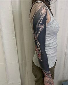 a woman with a tattoo on her arm