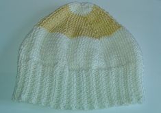 Beautiful gold and cream hand daisy coloured knitted hat in 100% cotton. Crown circumference of hat is 39 cms. Machine washable at 40C Cool iron. Daisy Hat, Cotton Crown, Knitted Hat, Skull Cap Beanie, Skull Cap, Knitted Hats, Caps Hats, Accessories Hats, Winter Hats