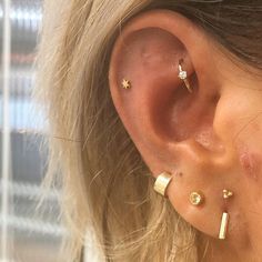 a woman with ear piercings on her ears