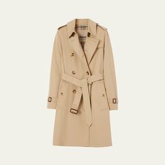 Burberry "Kensington" organic water-resistant gabardine trench coat featuring signature check lining and undercollar Trench collar with throat latch; double-breasted front Long sleeves; belted cuffs Chest gun flap; back rain shield Belted waist Shoulder epaulets Side flap pockets Straight fit Knee length Center-back vented hem Organic cotton Made in United Kingdom Classic Pea Coat With Belted Cuffs For Work, Classic Gabardine Outerwear With Double-breasted Fastening, Classic Double-breasted Gabardine Outerwear, Classic Double-breasted Outerwear With Belted Cuffs, Classic Outerwear With Belted Cuffs, Classic Belted Pea Coat For Business, Classic Gabardine Belted Outerwear, Classic Business Outerwear With Belted Cuffs, Evening Flats