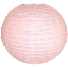 a round pink paper lantern on a white background