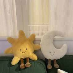 two stuffed animals sitting next to each other