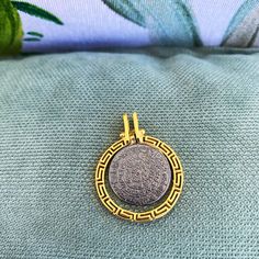 Buy an original Greek Pendant 24k Gold plated Phaistos Disk Meander | Discover Greek Jewelry within a huge collection of Ancient Greek Jewelry | shipping worldwide This amazing piece of jewelry is representing the Ancient Greek Symbol so called Phaistos disc. An excellent gift for women and also for men that would love to wear a geometric symbol. Ideal present for someone who have already spent time in this beautiful island or he comes from this. Size The diameter of the big disc is 2.8cm The th Luxury Sterling Silver Coin Necklace, Luxury Sterling Silver Coin Necklace With Round Pendant, Silver Gold-plated Jewelry With Coin Pendant, Luxury Coin Pendant Necklace As Gift, Luxury Coin Pendant Necklace Gift, Luxury Silver Coin Necklace Tarnish Resistant, Luxury Silver Tarnish-resistant Coin Necklace, Luxury Silver Tarnish Resistant Coin Necklace, Minimalist Gold Jewelry Stamped 925